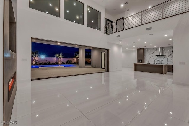 2827 Richmar Ave, Henderson, NV 89074 - unfurnished living room with a high ceiling and visible vents