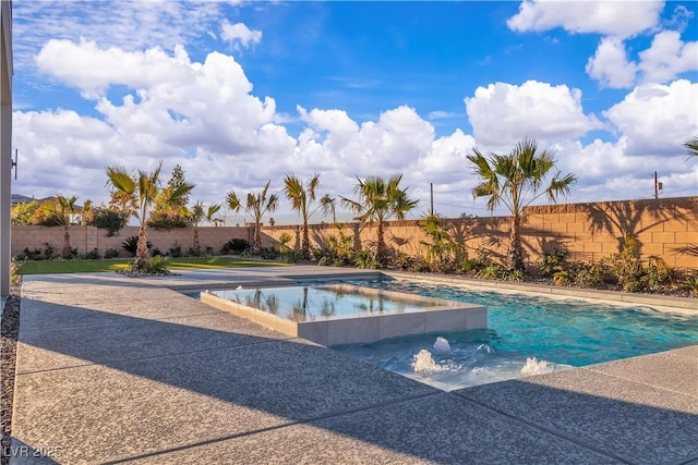 view of pool with a pool with connected hot tub and fence