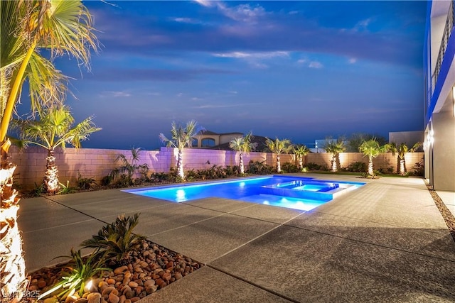 view of swimming pool with a patio area, a fenced backyard, and a pool with connected hot tub