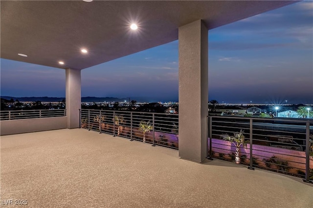 patio terrace at dusk with a balcony