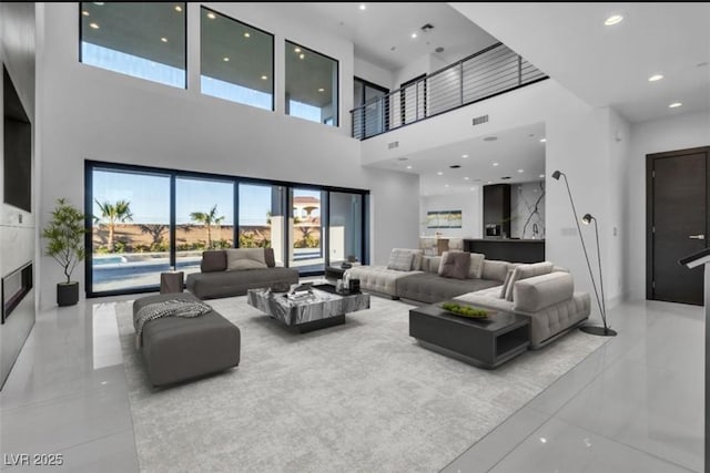 2827 Richmar Ave, Henderson, NV 89074 - living area featuring marble finish floor, visible vents, a glass covered fireplace, and recessed lighting