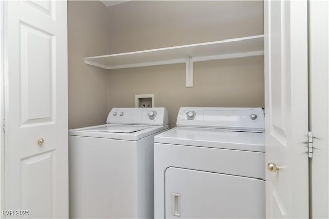 clothes washing area featuring laundry area and washing machine and dryer