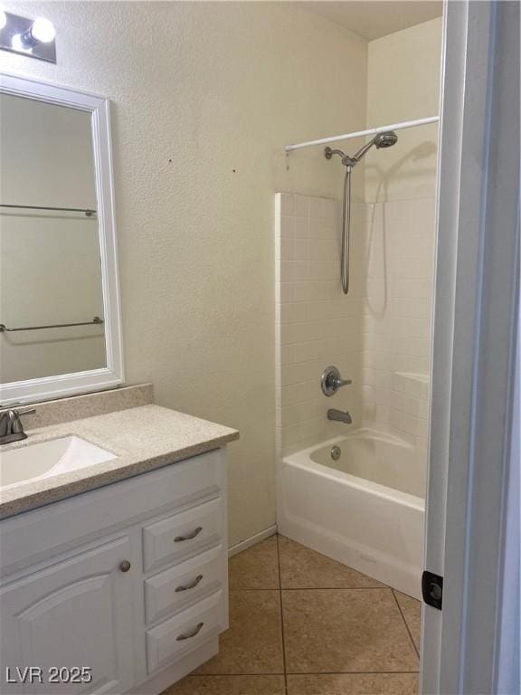 bathroom with tub / shower combination, vanity, and tile patterned floors