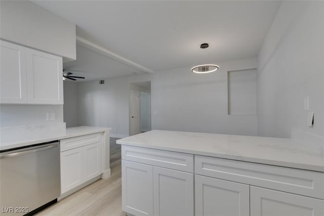 kitchen with hanging light fixtures, stainless steel dishwasher, white cabinetry, and light wood-style floors