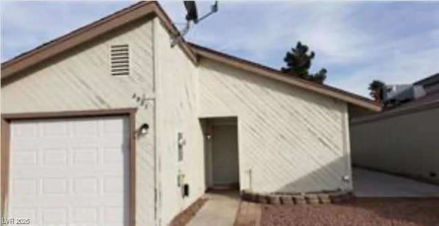 view of home's exterior featuring an attached garage