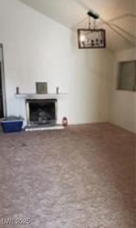 basement featuring a fireplace with raised hearth