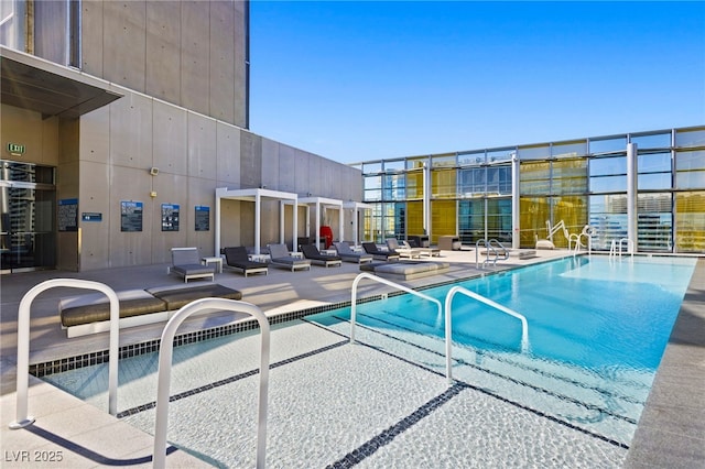 community pool with a patio area