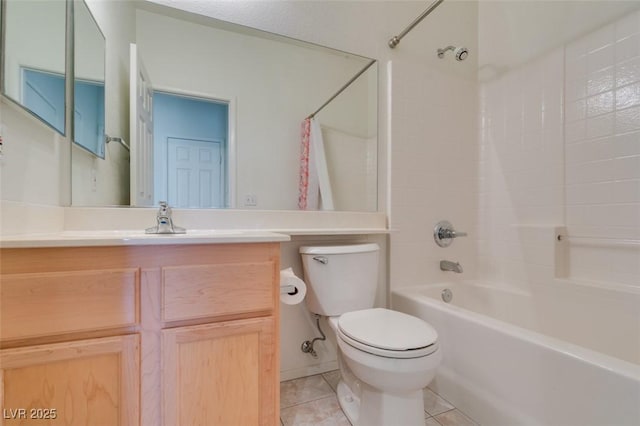 bathroom featuring vanity, shower / washtub combination, tile patterned flooring, and toilet