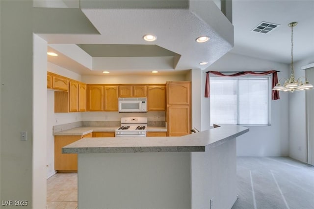 kitchen with recessed lighting, a raised ceiling, light countertops, visible vents, and white appliances