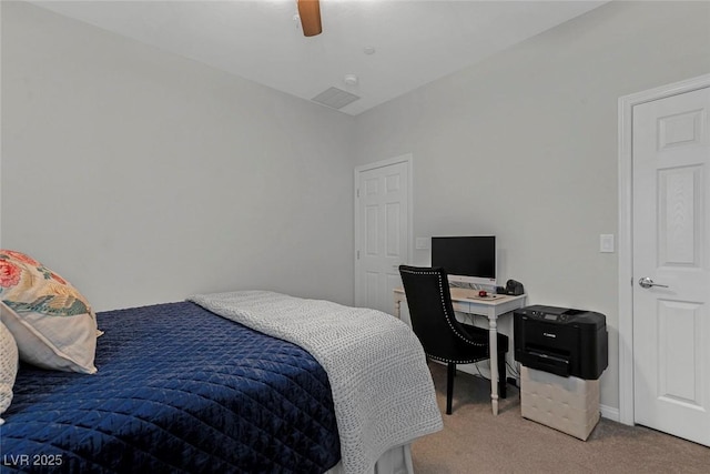 carpeted bedroom with baseboards and a ceiling fan