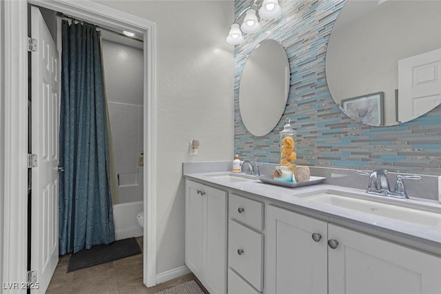 bathroom featuring double vanity, tile patterned flooring, decorative backsplash, and a sink