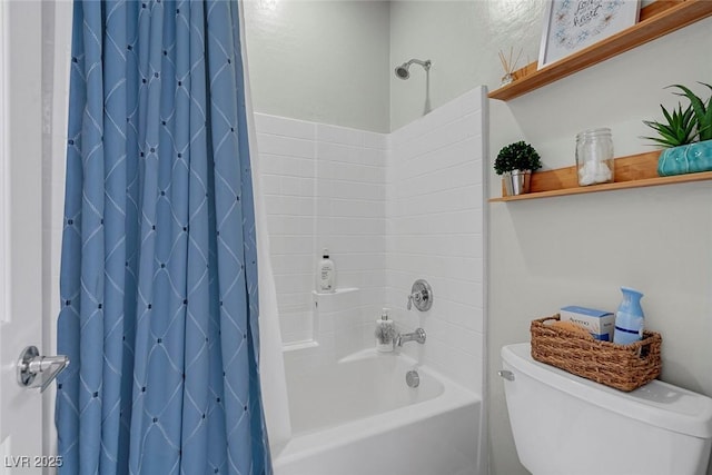 bathroom featuring shower / tub combo and toilet