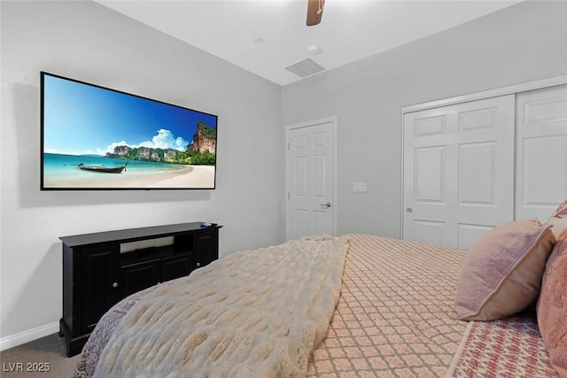 carpeted bedroom with a ceiling fan, a closet, visible vents, and baseboards