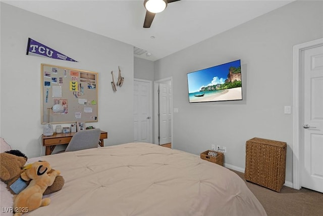 carpeted bedroom with ceiling fan and baseboards