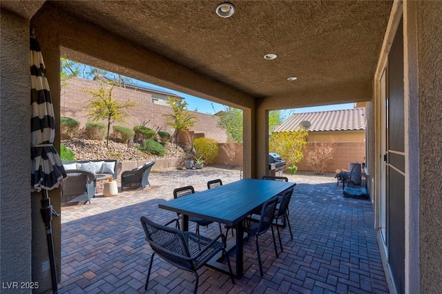 view of patio / terrace featuring outdoor dining space and a fenced backyard