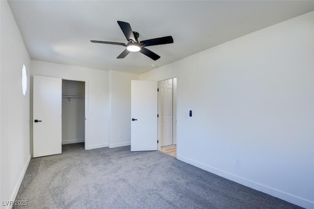 unfurnished bedroom featuring a ceiling fan, carpet, a closet, and baseboards