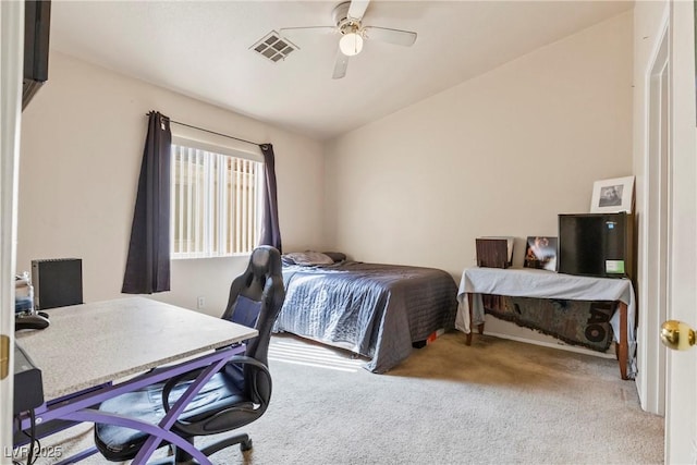 bedroom featuring vaulted ceiling, carpet flooring, visible vents, and a ceiling fan