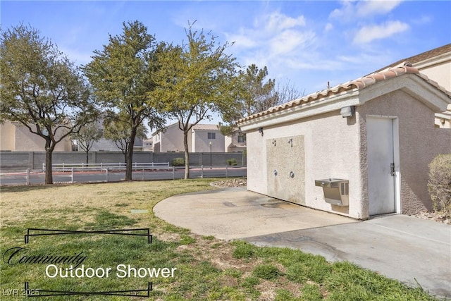 view of yard with fence and a patio