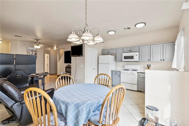 dining room with a ceiling fan, visible vents, and light tile patterned floors