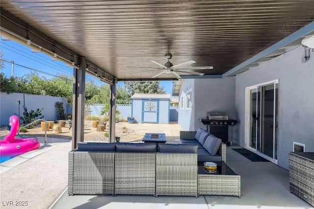 view of patio / terrace featuring an outdoor hangout area, a grill, a shed, a fenced backyard, and an outdoor structure