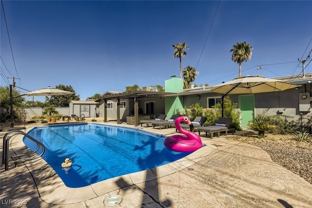 view of swimming pool with a fenced in pool, a patio area, and fence