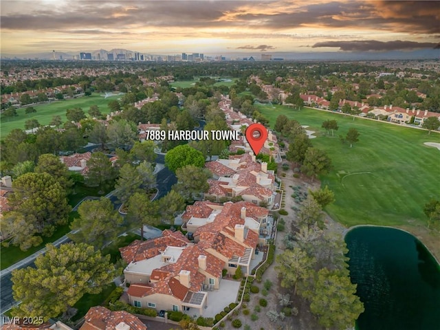 bird's eye view featuring view of golf course and a view of city