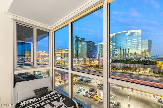 sunroom / solarium featuring a view of city