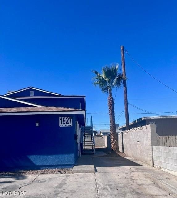 view of property exterior featuring fence