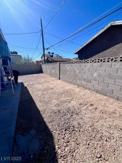 view of yard with a fenced backyard