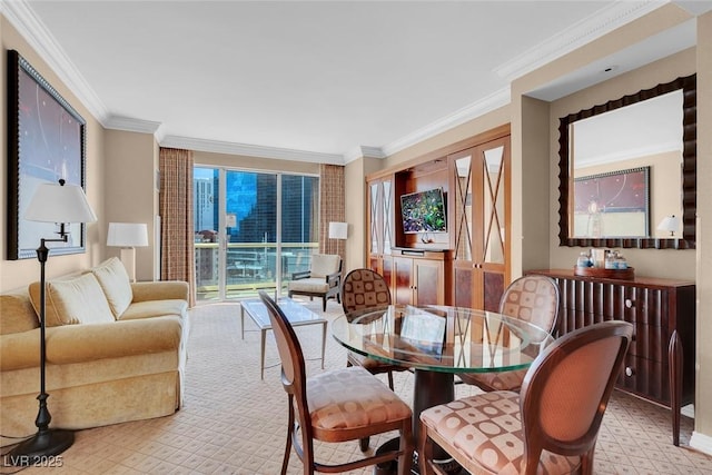 dining area with light floors and crown molding