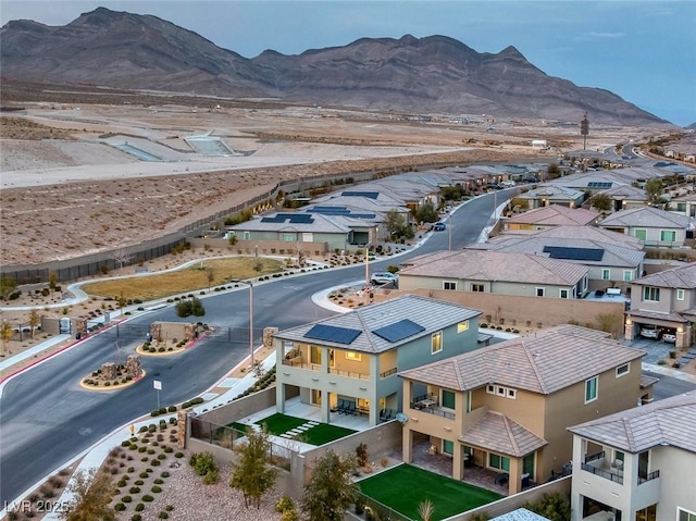 drone / aerial view with a residential view and a mountain view