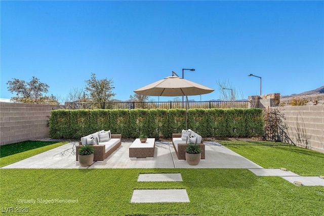 exterior space featuring a patio area, a fenced backyard, and an outdoor living space