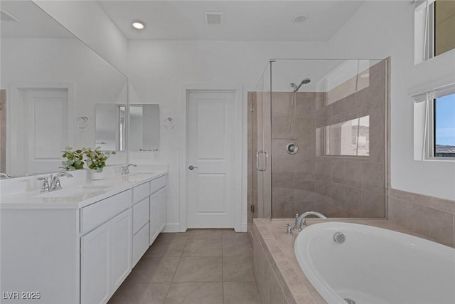 bathroom with a garden tub, visible vents, a sink, a shower stall, and tile patterned flooring