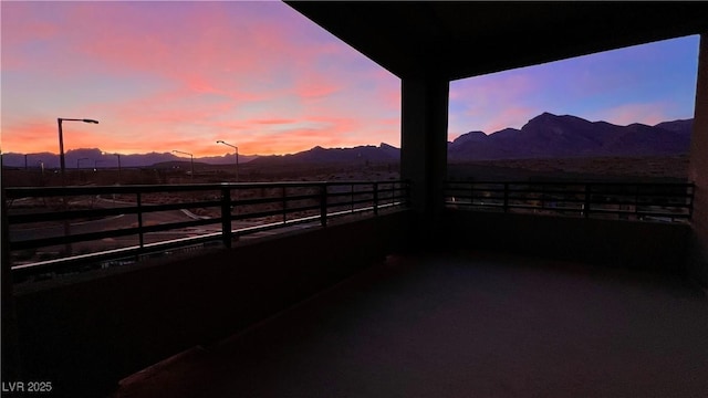 exterior space featuring a balcony and a mountain view