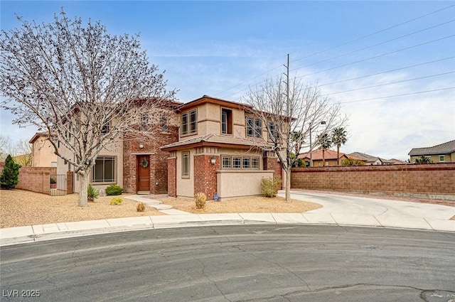 view of front of home featuring fence and stucco siding