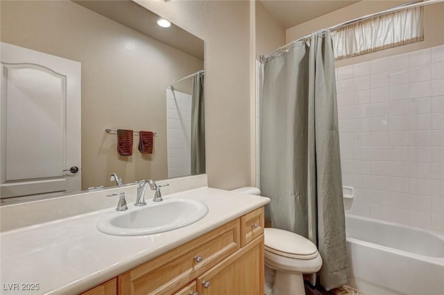 bathroom featuring vanity, shower / bath combo with shower curtain, and toilet