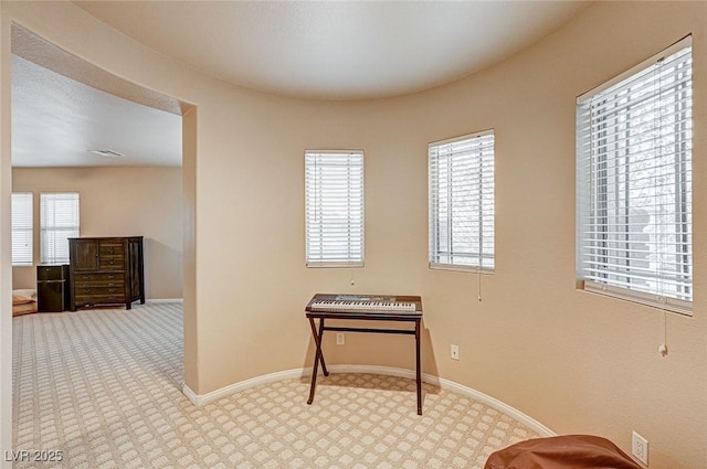 interior space with visible vents, plenty of natural light, and baseboards