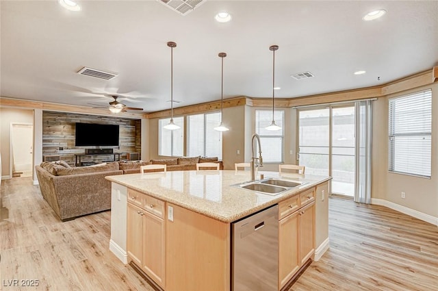 kitchen with visible vents, a sink, dishwasher, and light brown cabinetry