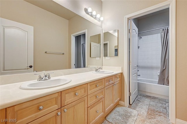 full bath featuring double vanity, shower / bath combo with shower curtain, and a sink