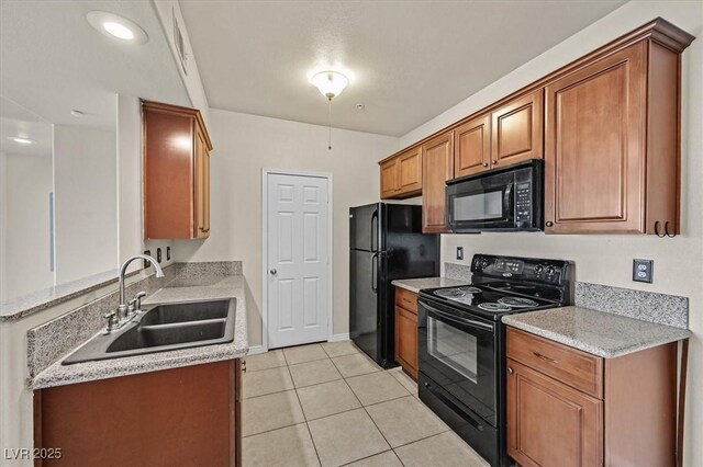 3550 Bay Sands Dr Unit 2087, Laughlin, NV 89029 - kitchen featuring black appliances, a sink, light tile patterned floors, and brown cabinets