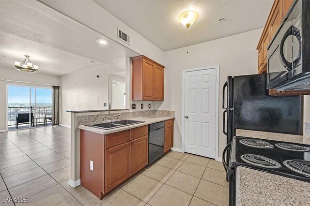 3550 Bay Sands Dr Unit 2087, Laughlin, NV 89029 - kitchen featuring black appliances, a sink, brown cabinets, light tile patterned floors, and baseboards
