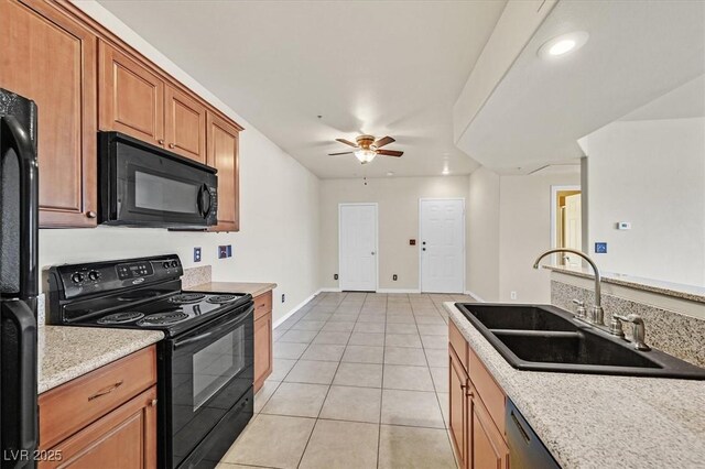 3550 Bay Sands Dr Unit 2087, Laughlin, NV 89029 - kitchen with black appliances, a sink, ceiling fan, light tile patterned flooring, and light countertops