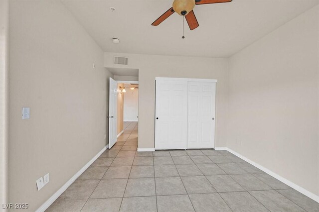 3550 Bay Sands Dr Unit 2087, Laughlin, NV 89029 - unfurnished bedroom featuring light tile patterned flooring, baseboards, a closet, and ceiling fan
