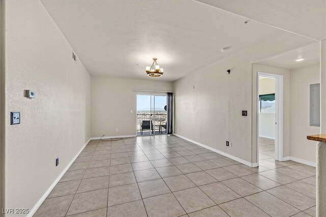 3550 Bay Sands Dr Unit 2087, Laughlin, NV 89029 - unfurnished living room featuring light tile patterned floors, a chandelier, and baseboards