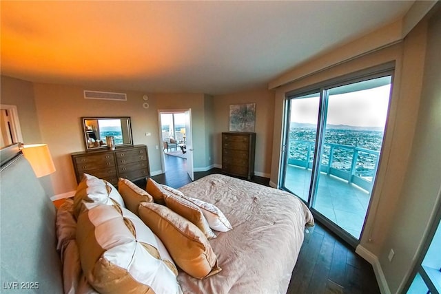 bedroom featuring access to outside, dark wood-style flooring, visible vents, and baseboards