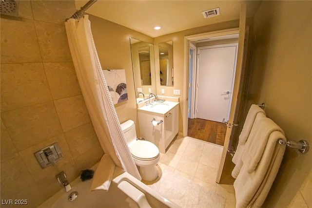 bathroom with shower / bath combination with curtain, visible vents, toilet, vanity, and tile patterned flooring