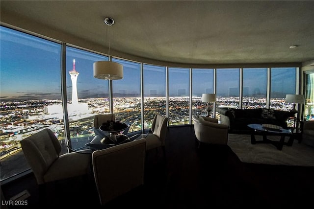 sunroom / solarium featuring a city view