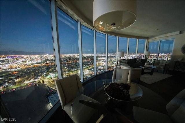 sunroom / solarium featuring a city view