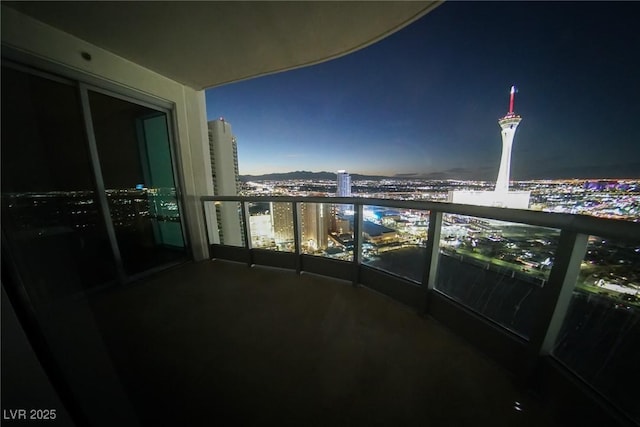 balcony featuring a view of city lights