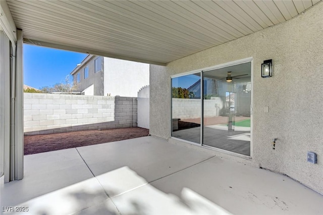 view of patio / terrace featuring fence